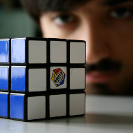Myself behind a Rubik cube